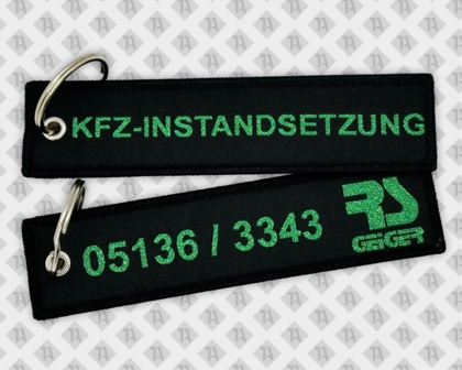 Gewebter Schlüsselanhänger mit Metllicgarn grün KFZ Instandsetzung Geiger